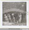 July, 1964 - Four men work with hand tools in a reinforced pit.  Courtesy State Historical Society of North Dakota.